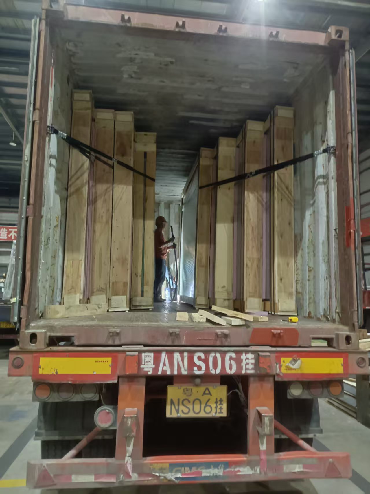 Glass export crates being loaded into a container